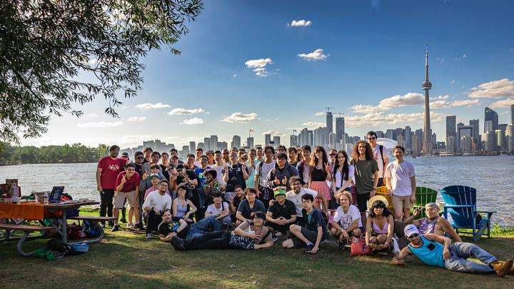 Toronto TFT's Summer Social: a crowd on Toronto Island with the skyline behind