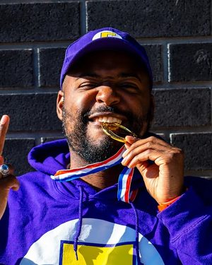 Michael biting the WS2 winner's medal at Windsor Showdown 3, Sep 2024