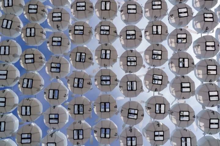 Rows of white lanterns hanging overhead