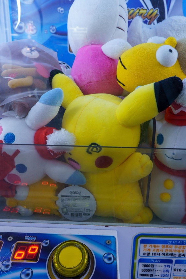 Pikachu plush toys piled in a claw machine