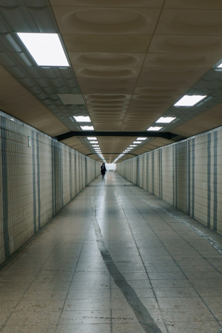A long, empty underground corridor