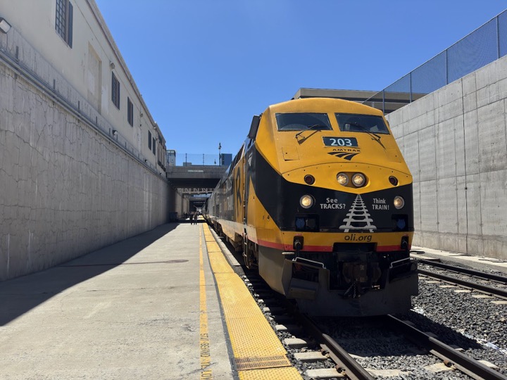 A yellow and black locomotive at the sunken platform in Reno