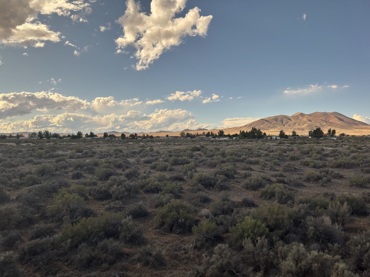Sagebrush desert under scattered clouds in Nevada