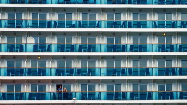 Rows of balconies on the side of a cruise ship